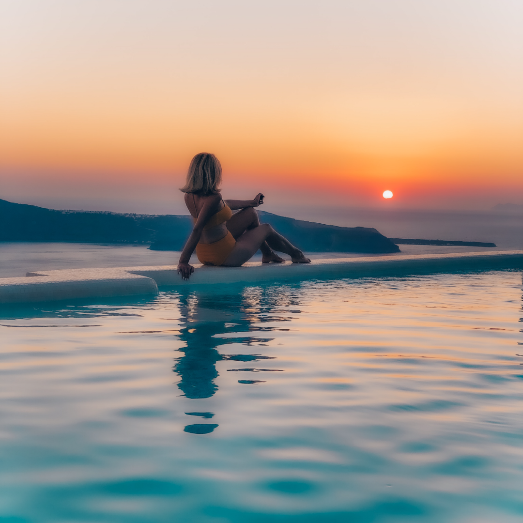 Stunning Sunset views from the Infinity Pool at Astra Suites Hotel in Imerovigli Santorini