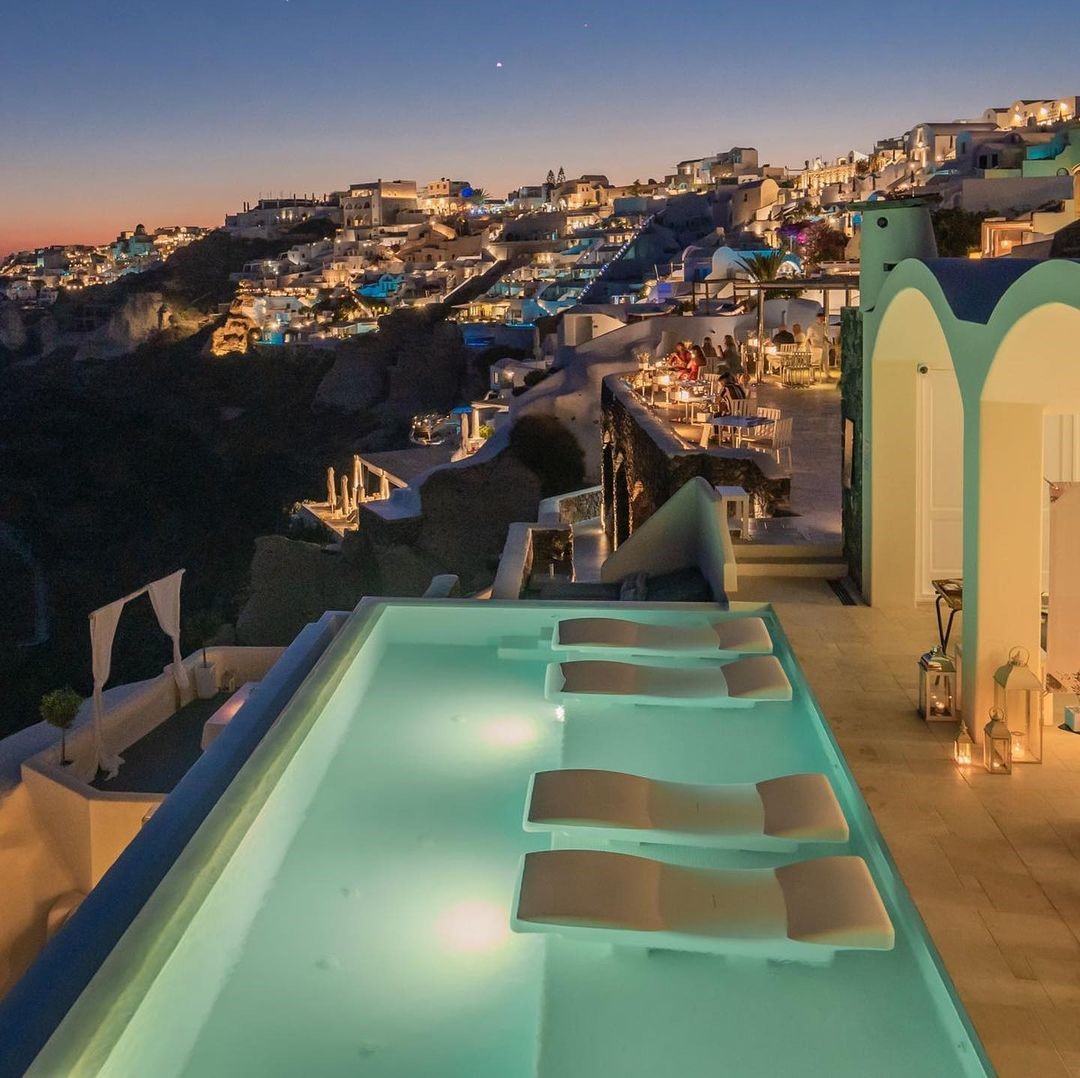 Infinity Pool with sunset views over Oia Town at Canavas Oia Suites